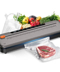 6-In-1 Vacuum Sealer For Food Preservation, Compact 75kPa Sealing Machine in Titanium Gray with vegetables and meat bag