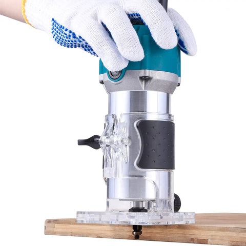 Rock Solid Electric Wood Router And Smooth Operator Trimmer featuring a soft cushion grip, used on a wooden surface.