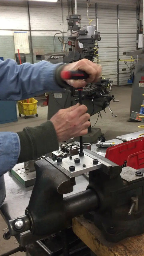 Person using Power T Handle Torx Star Key Set 11 Piece Range T6 Through T50 With 6 Inch Shafts Made In America on workshop table