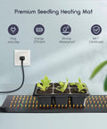 Seedling Heating Mat For Seed Starting 10 x 20.75 Inch Pro Grade Waterproof Hydroponic Heating Pad with seedlings and plug.