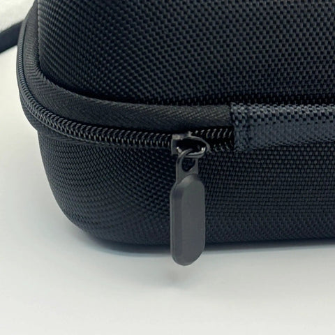 Close-up of zipper on Tesla NACS To CCS1 Adapter Storage Case Eva Nylon Protective Gear Bag, showcasing sturdy design.