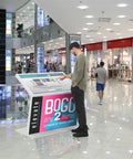 Real Deal Forty Nine Inch Interactive Touchscreen Kiosk Running Android Fourteen And Vibrant Full Hd Display Seriously Impressive For Wayfinding Or Quick Guest Check Ins, positioned in a mall.