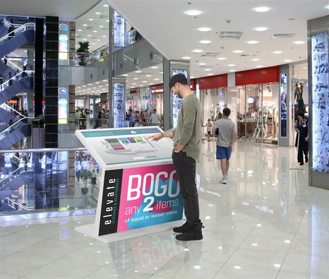 Real Deal Forty Nine Inch Interactive Touchscreen Kiosk Running Android Fourteen And Vibrant Full Hd Display Seriously Impressive For Wayfinding Or Quick Guest Check Ins, positioned in a mall.