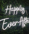 Two Piece LED Neon Light Sign Set Happily Ever After, Dual Panels 14.6x7.5 and 20.9x7.5 Inch against green background