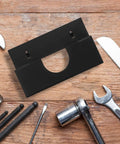 Black Iron Angle Grinder Holder Rack For Garage And Workshop Wall Mount Tool Organizer on wooden surface with tools