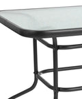 Corner view of Modern Rippled Glass Outdoor Dining Table with Umbrella Hole, Rectangular 31.5 Inch by 55 Inch, black metal frame.