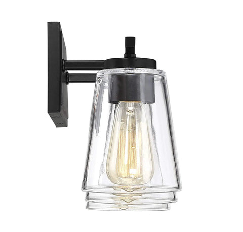 Calhoun Modern Bohemian Clear Glass Vanity Wall Light Three Light Fixture, black backplate, single bulb close-up