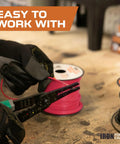 6 AWG Heavy Duty Battery And Automotive Wiring Kit being cut with tools, showcasing red and black CCA cables on spools.