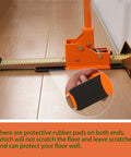 Side view of orange hardwood flooring jack installation tool with toothed rail and rubber guard.