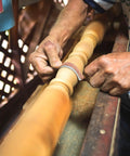 Close-up of hands using Emery Cloth Roll Kit With Six Grits 80 120 240 320 400 600 Pro Grade One Inch By 19.7 Foot Sandpaper on wood