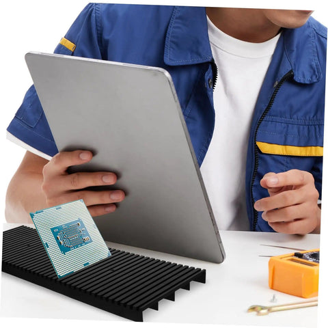 Person using Anti Static Circuit Board Holder And PCB Storage Rack For Secure Electronic Projects with tablet.
