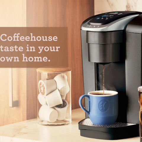 Kick Up Your Morning Routine With This Dope Single Serve Coffee Maker Featuring K Cup Compatibility Strong Brew And Iced Settings Programmable Temp Control Plus Multiple Cup Sizes In Solid Brushed Slate, brewing coffee into a blue cup.