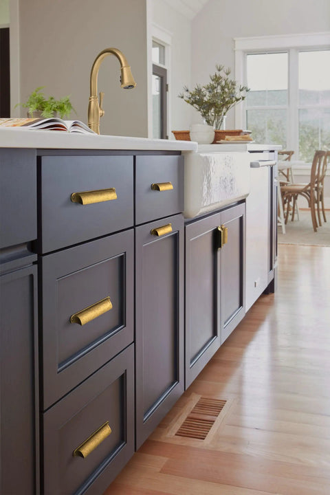 Kitchen cabinets with six pack antique brass cup pulls for cabinets and drawers, 5.04 inch center to center with classic brass finish.
