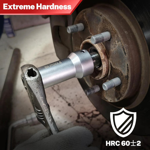 Biltools axle spindle rethreading tool in silver used on a rusted wheel hub with studs
