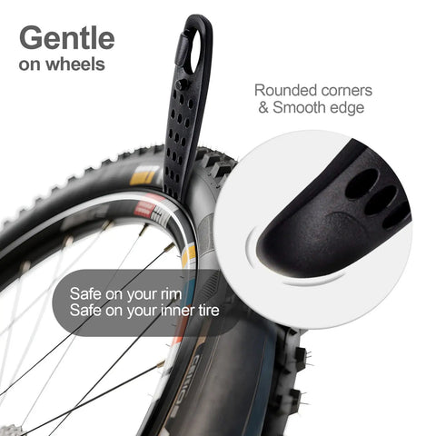 Close-up of Ultra Strong Bicycle Tire Levers Set, showing black lever lifting bike tire, smooth edges, compact roadside repair kit.