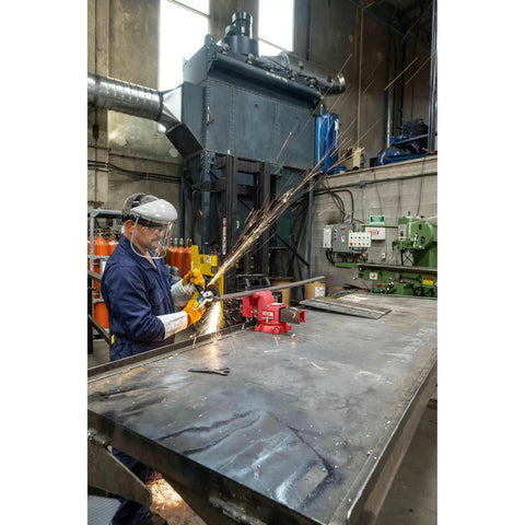 Worker using Swivel Bench Vise Six Inch Opening With Three And A Half Inch Throat, 360 Degree Rotating Base With Lock Down in workshop