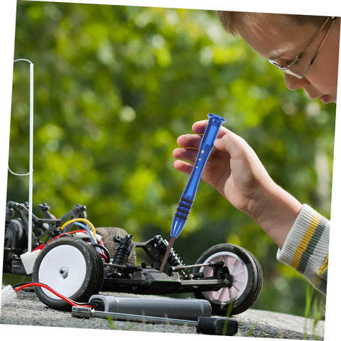Child using wrench from Must-Have RC Car Screw And Bolt Kit For Quick Repairs And Routine Maintenance With Wrench Included on RC model