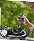 Child repairing RC car with "RC Car Screw Kit With Fasteners And Gasket Pro Grade Repair Tools Set For Remote Control Cars, Metric Screw Assortment"