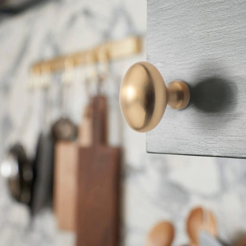 10 Pack Oval Ellipse Single Hole Cabinet Knobs In Champagne Bronze Zinc Alloy Furniture Pulls installed on kitchen cabinet
