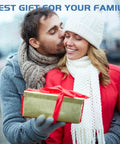 Man and woman in winter clothing exchanging a wrapped gift outdoors