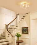 Interior with Two Light Star Ceiling Light with Glass Shade in Modern Brass Finish close to ceiling flush mount in entryway
