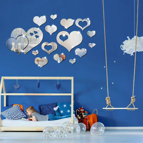 Heart Mirror Wall Decal Set 17 Pieces 3D Acrylic Reflective Stickers Removable Wall Art Decor For Living Room And Bedroom Easy Peel And Stick Waterproof Backed Mirror Art on blue wall with child and swing