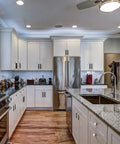 White kitchen with Five Inch Modern Black And Gold Aluminum Cabinet Pulls 12 Pack Knurled Diamond Pattern Drawer Hardware.