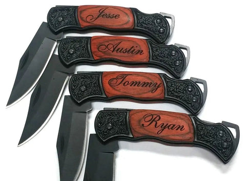 Four personalized engraved pocket knives with rosewood handles and names, featuring steel blades and intricate designs.