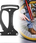 High Precision Aluminum Bicycle Spoke Tension Meter Tool For MTB And Road Bikes With Easy Readout Durable Wheel Tension Gauge For Accurate Spoke Tension On All Rims Pro Grade next to a bicycle wheel