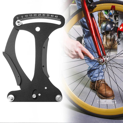 High Precision Aluminum Bicycle Spoke Tension Meter Tool For MTB And Road Bikes With Easy Readout Durable Wheel Tension Gauge For Accurate Spoke Tension On All Rims Pro Grade next to a bicycle wheel