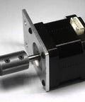Rigid Shaft Coupling 1 Inch Bore 2 Inch Outside Diameter 3 Inch Long Black Oxide Coated 1045 Steel With 4 Set Screws attached to motor