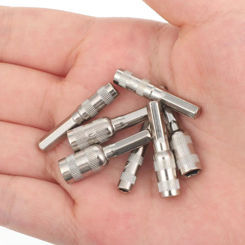 Hand holding 7 Piece Hex Socket Adapter Set With H4 Shank Metric Micro Socket Sizes 2.5mm Through 5.5mm for mini drills