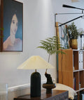 Cream Ceramic Table Lamp With Fabric Lampshade, Modern Retro Vibe For Living Room or Study, on wooden cabinet.
