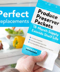Hand holding FreshFlow Compatible Produce Preserver Packets 6 Pack For Whirlpool And KitchenAid Refrigerators in front of fridge