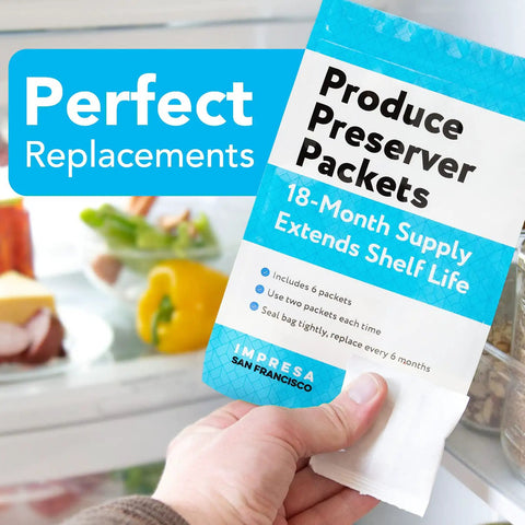 Hand holding FreshFlow Compatible Produce Preserver Packets 6 Pack For Whirlpool And KitchenAid Refrigerators in front of fridge