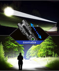 Beast Mode 100000 Lumen Flashlight With Zoom Beam illuminating a forest path at night, demonstrating its zoomable spotlight feature.