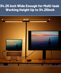 Dope 34.25 Inch Architect Desk Lamp in Black for Home Office illuminating a workspace with laptop and monitor