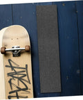 Non Slip Grip Tape For Skateboard Decks And Electric Scooters Heavy Duty PVC Material with skateboard on wooden floor