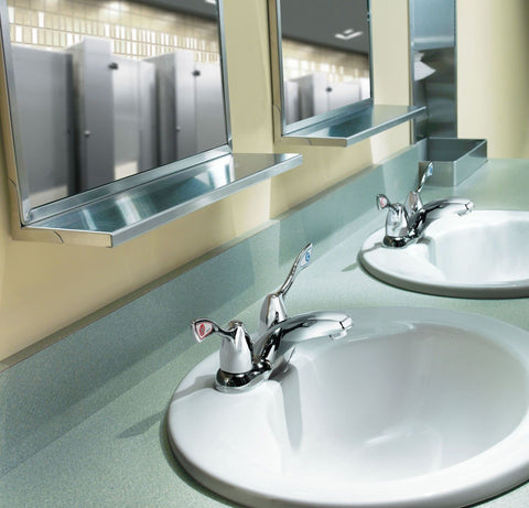 Commercial Two-Handle Centerset Lavatory Faucet With Drain In Chrome Finish, 4-Inch, 1.5 GPM Flow on a restroom sink