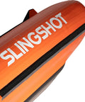 Close-up of the Slingshot branding on the Ultrafly Wing Foil Board 105 L Inflatable Travel Ready Packable Setup With Rapid Release System For Easy Lift Off And Stable Handling Ride Ready Progression Friendly Perfect For Wing Foil Beginners And Riders On The Go showing the bright orange exterior and design details.