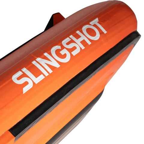 Close-up of the Slingshot branding on the Ultrafly Wing Foil Board 105 L Inflatable Travel Ready Packable Setup With Rapid Release System For Easy Lift Off And Stable Handling Ride Ready Progression Friendly Perfect For Wing Foil Beginners And Riders On The Go showing the bright orange exterior and design details.