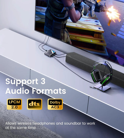 Run Your Rig Wild With This Dope 1x3 Digital Optical Splitter, Slinging Toslink SPDIF Audio To Three Awesome Devices, Backing Dolby Digital And DTS 5.1 Surround Sound Perfection For Your Xbox PS5 Game Setup. Displayed next to a soundbar and headphones.
