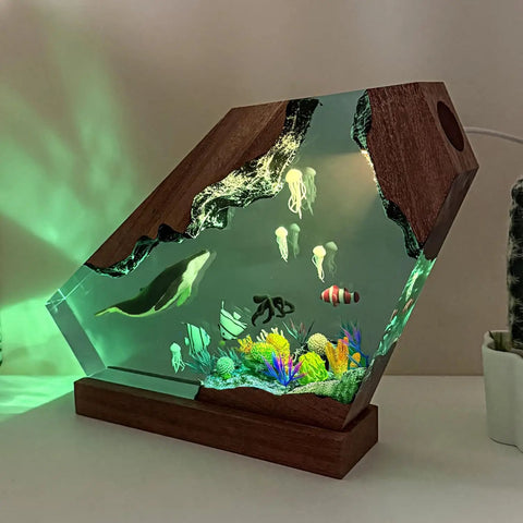 Blue Whale Resin Lamp With Wood Base RGB Ocean Nightstand Light featuring ocean scene with jellyfish and fish for coastal decor.