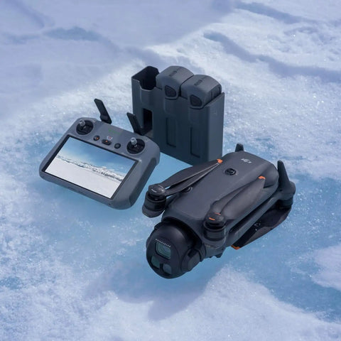 Mavic 4 Pro Drone Fly More Combo With RC 2, 100MP 4/3 Hasselblad Camera, charging hub on icy surface.