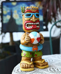 16.7 Inch Tiki Garden Statue With Solar Powered Lantern Lights, Large Hawaiian Tiki Man Figurine holding beach ball on table