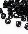 60 Pack 1/2 Inch Snap In Cable Bushing Grommets In Black Nylon Locking Housings scattered on white surface