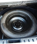 Car trunk with Spare Tire Hold Down Bolt For Cars And Trucks Easy Install Durable Wheel Retention Accessory securing spare tire