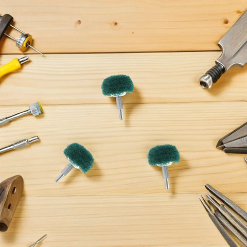 Versatile 2 Pc Mushroom Buffing Wheels With Handle For Drill on wooden surface, featuring green nylon pads for rust removal.