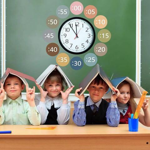 Children in classroom using Boho Rainbow Clock Numbers Bulletin Board Kit With 16 Telling Time Labels, Time Instruction Cards, And Self Adhesive Dots