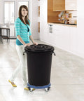 Woman using Round Trash Can Dolly With Wheels, Heavy Duty 440 Lb Capacity, Adjustable 15 To 19 Inch Diameter in a kitchen